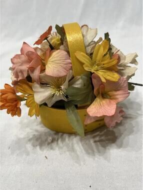 Shaker-style oval basket with artificial flowers